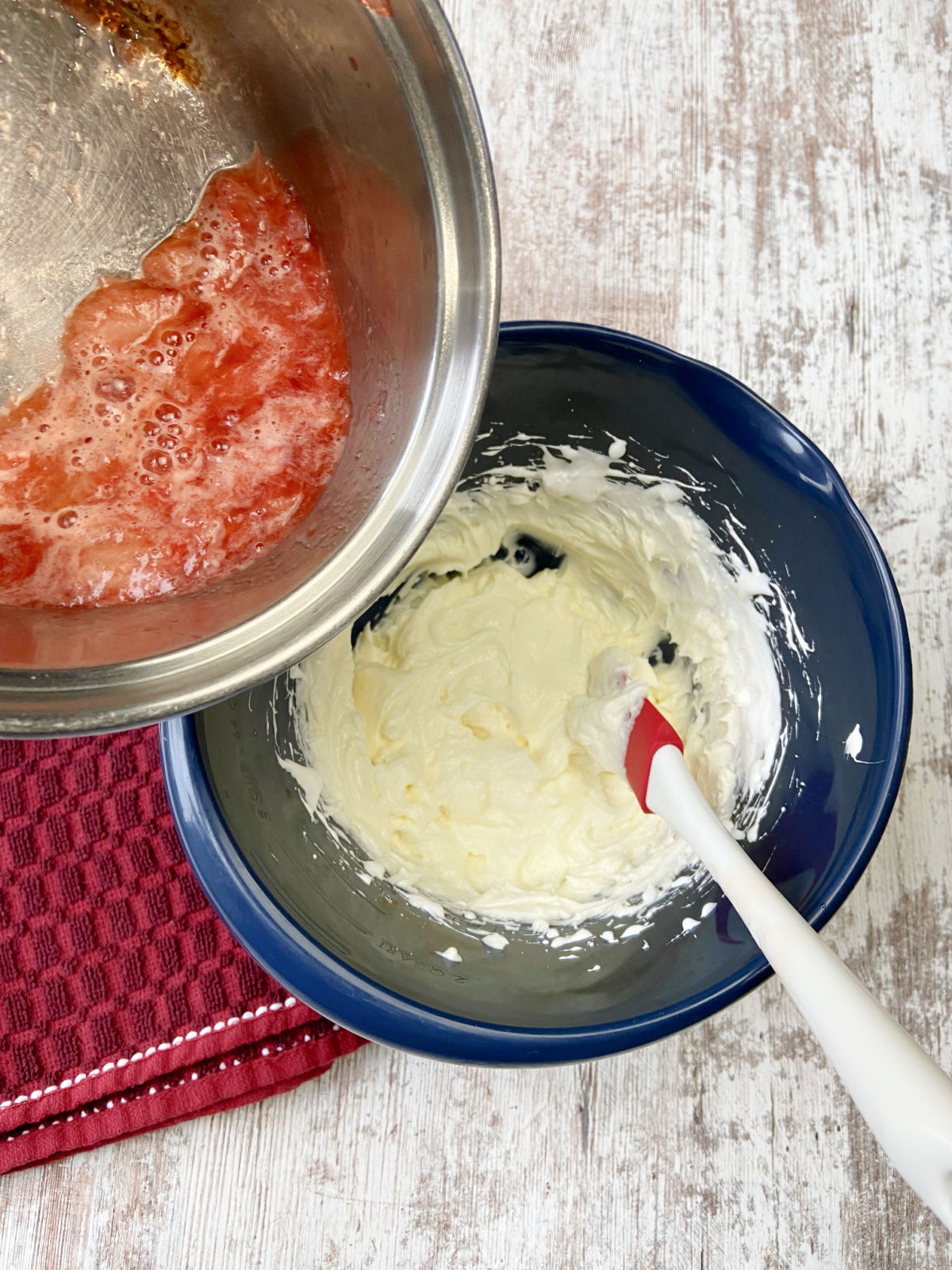 strawberries poured into a cream cheese mixture. 