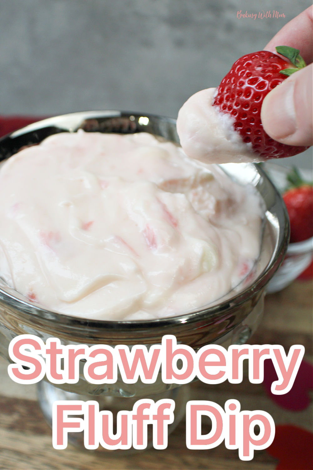 strawberry fluff dip in a bowl with a strawberry. 
