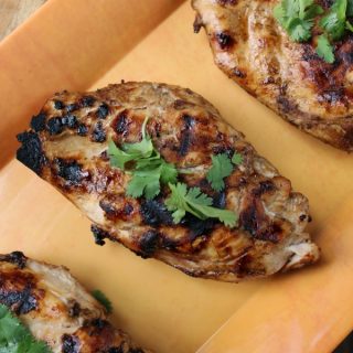 EASY Grilled Chicken Marinade Chicken breasts with basil on top