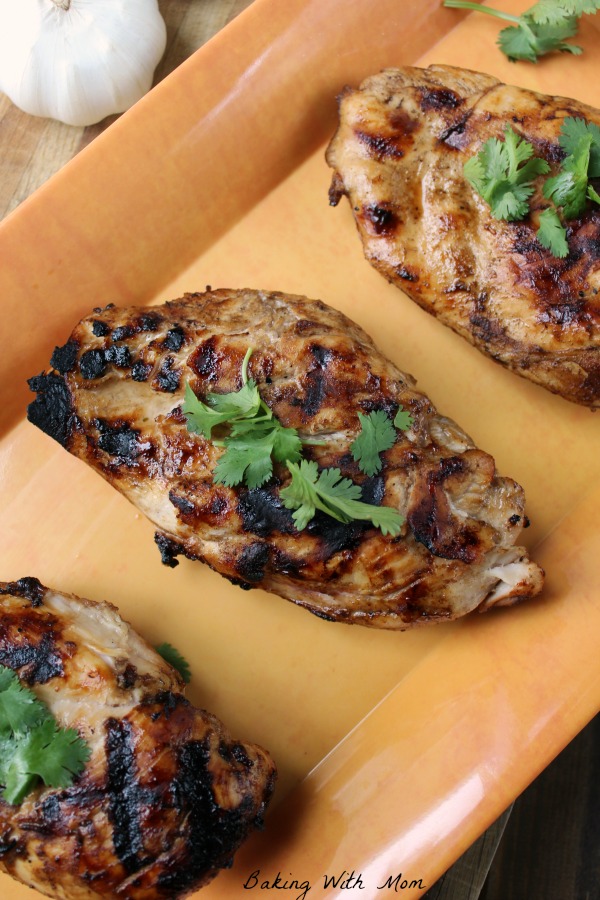 EASY Grilled Chicken Marinade Chicken breasts with basil on top