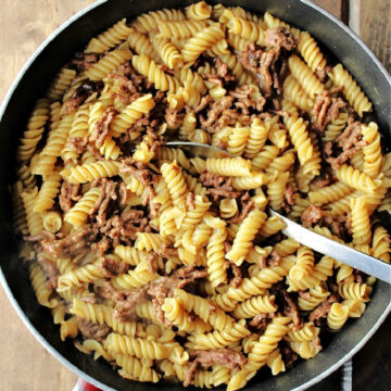 beef pasta with rotini noodles in a frying pan