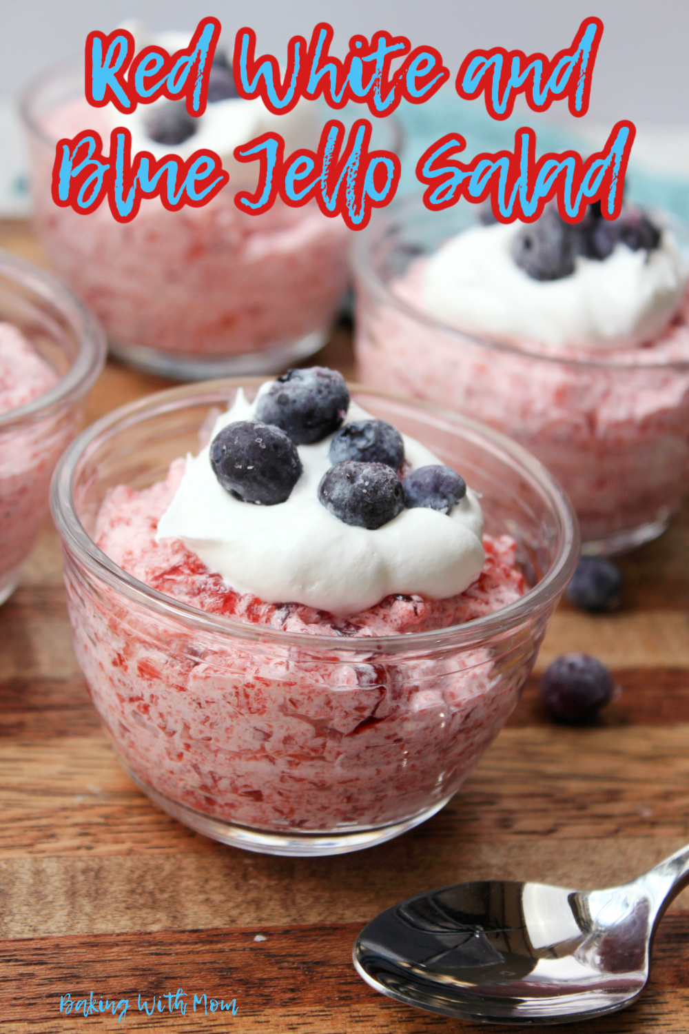 Red White And Blue Jello Salad cups on a brown board. 