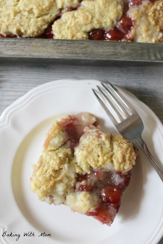 cherry coffee cake on a white plate with a fork