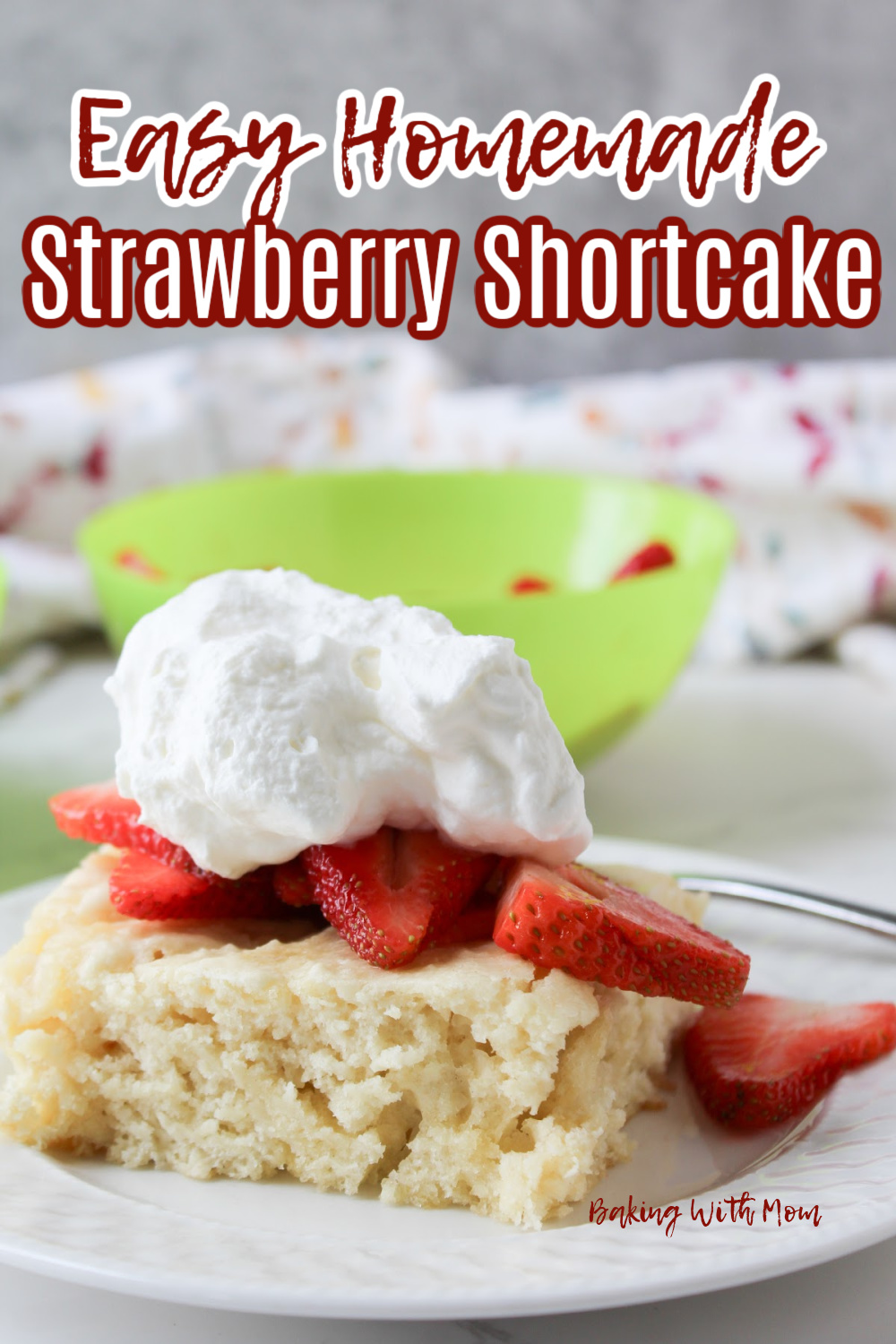 strawberries on a shortcake with whipping cream. 