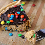 Peanut butter pie with m&m's on cutting board