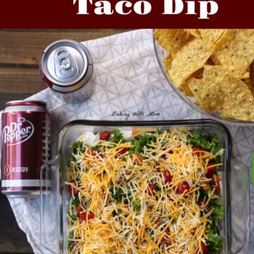 Easy Layered Taco Dip with hamburger, chips and cheese in a serving dish