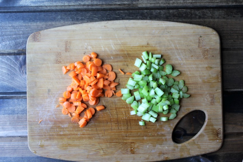Chopped carrots and celery on a cutting board