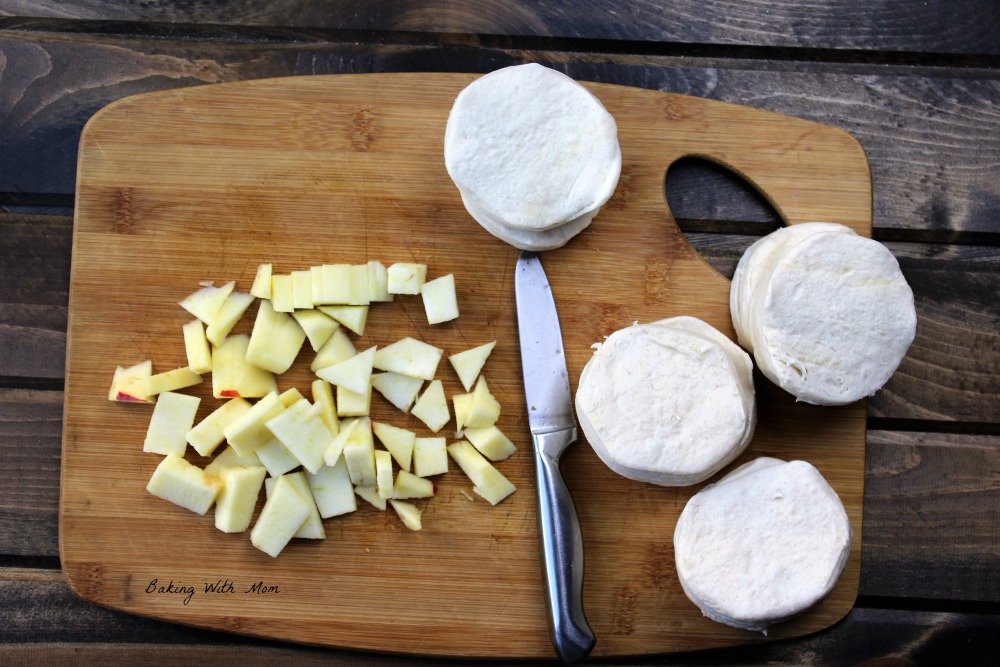 apples and biscuits on chopping board