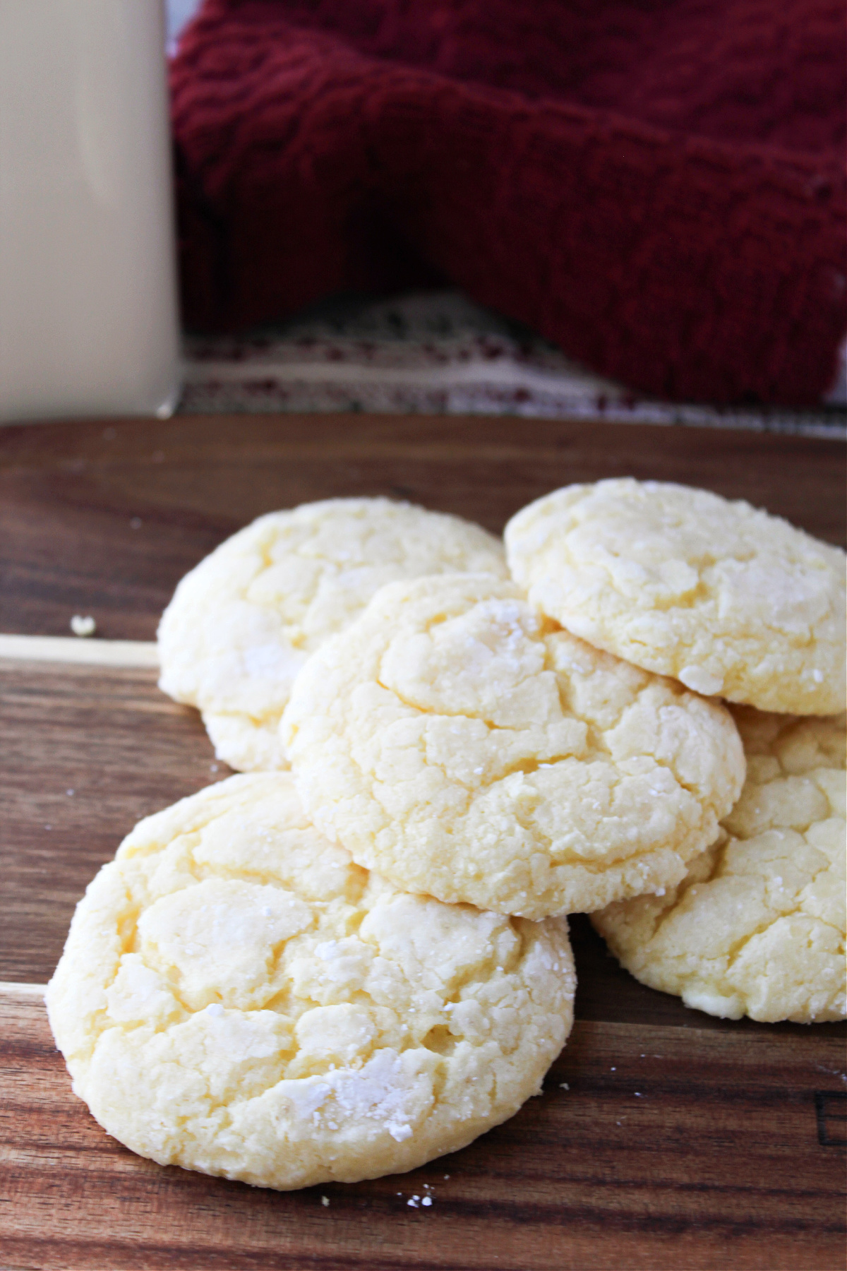 gooey butter cookies on a brown cutting board.