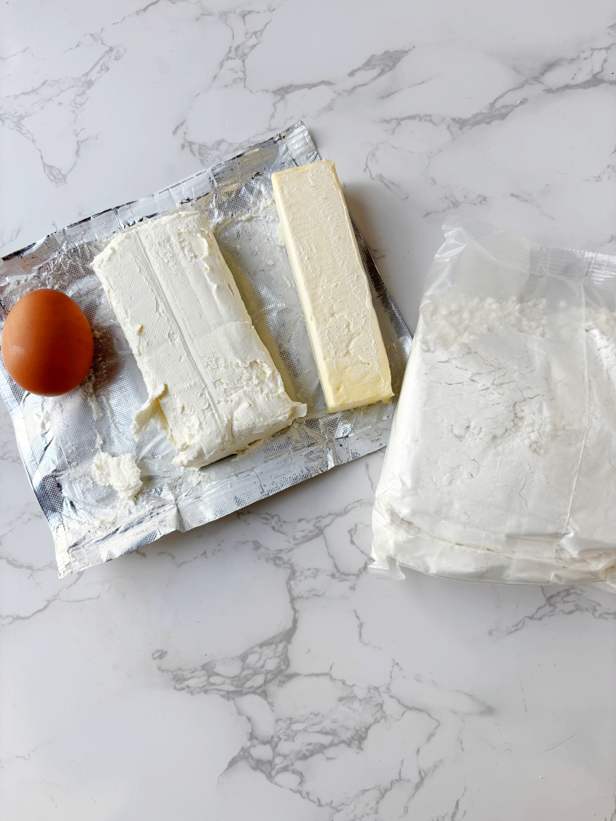 butter, cream cheese, egg and bag of cake mix.