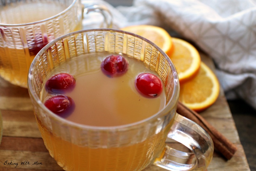 Slow Cooker Spiced Apple Cider with oranges in background