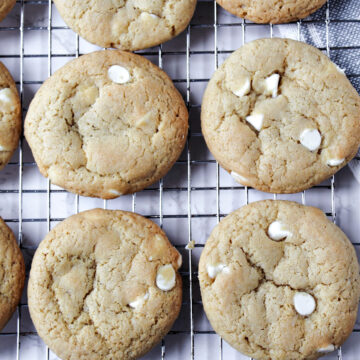 soft and chewy white chocolate chip cookies on a cooling rack.