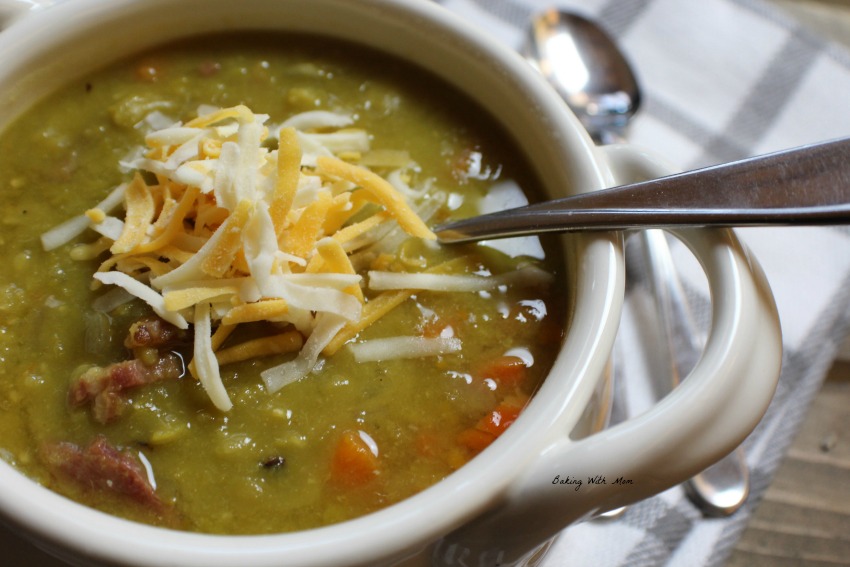 Crock Pot Split Pea Soup With Ham in a cream bowl with cheese sprinkled on top