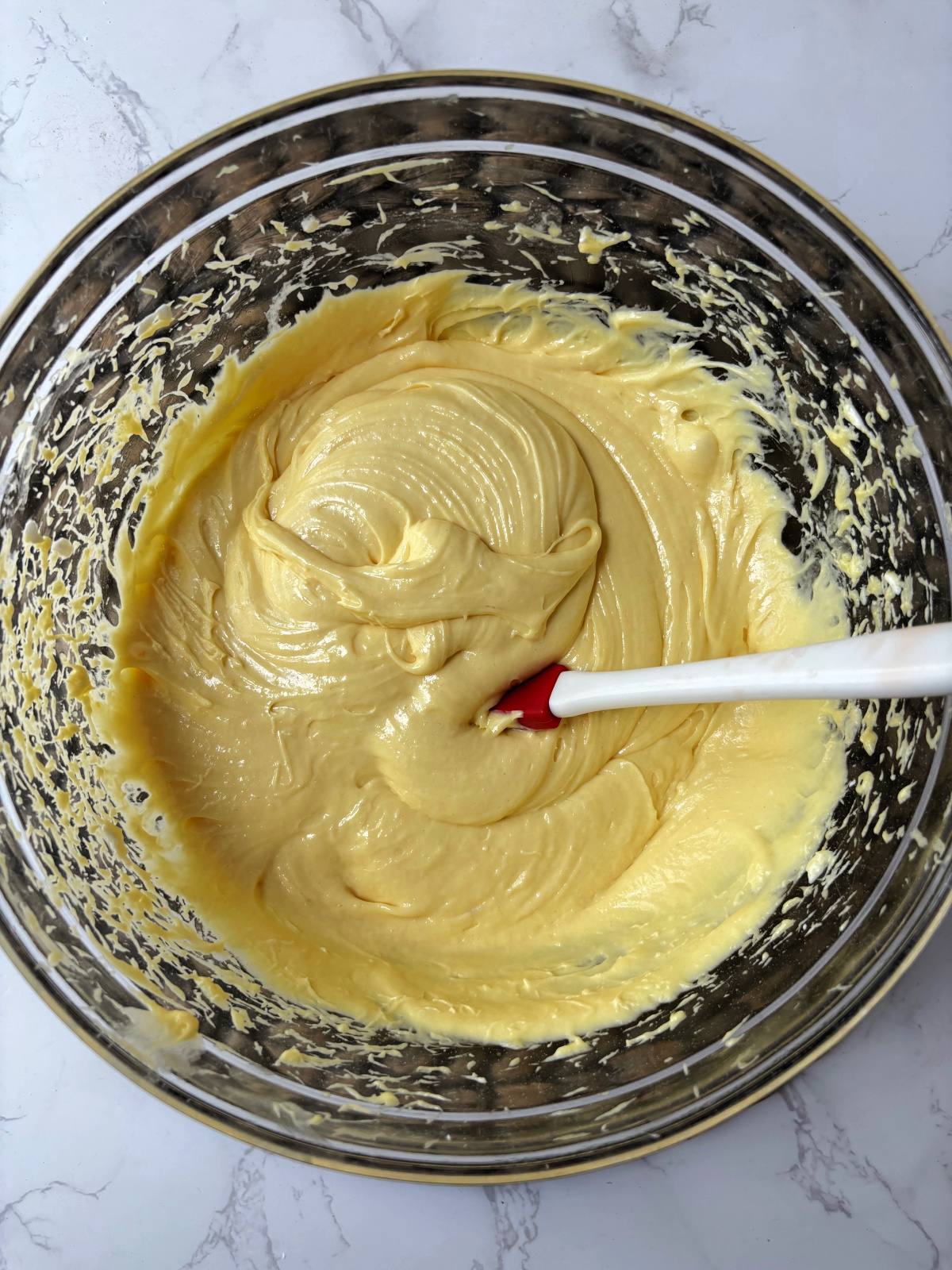 coffee cake batter in a clear bowl.