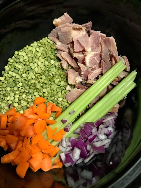 Carrots, onions, peas, ham in a crock pot precooked.