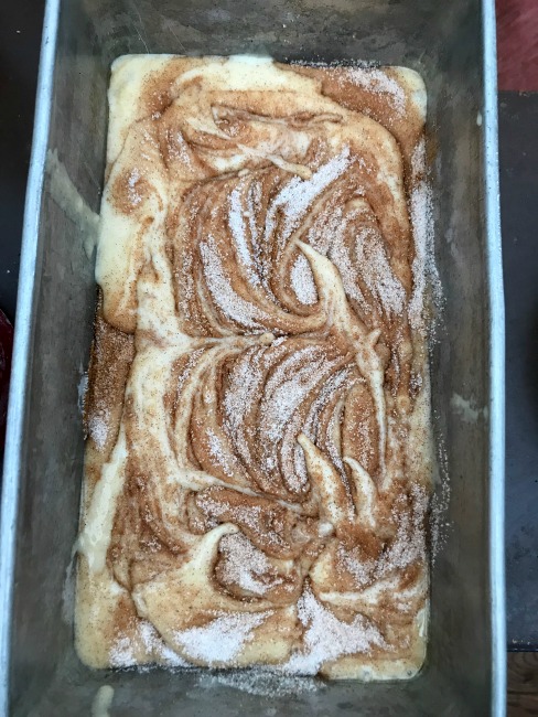 Cinnamon swirl dough in a pan