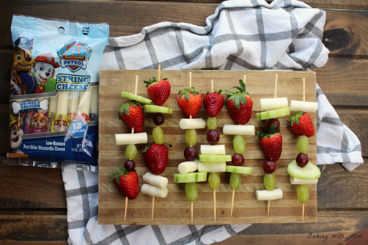 Easy Snack Kabobs with fruit and cheese on a cutting board.