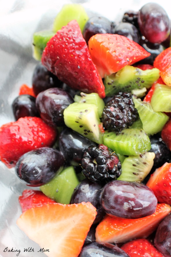 Kiwi, strawberry, grape and blackberry in a clear bowl