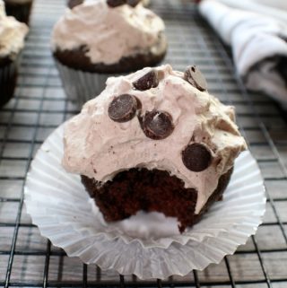 Homemade Devil's Food Cupcakes on a muffin cup and cooling rack
