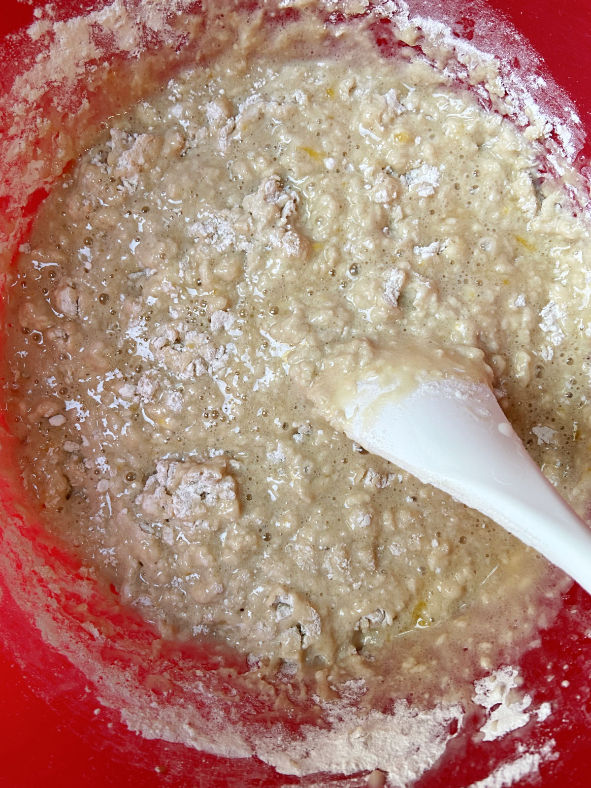 mixed batter in a red bowl. 