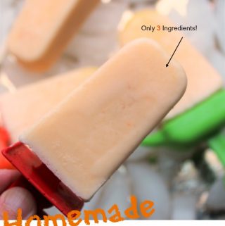 Orange Creamsicle Popsicles with a red handle