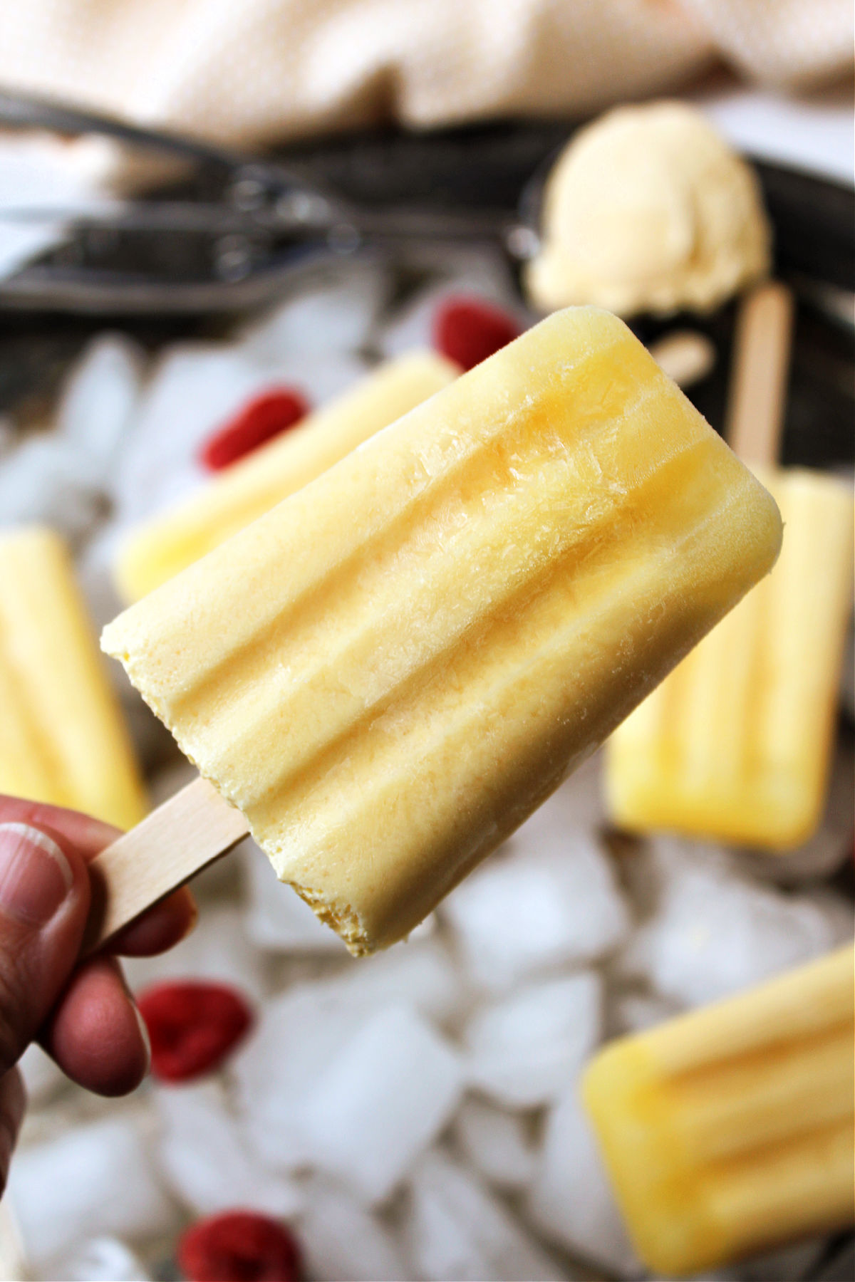 Orange creamsicle popsicles on a stick. 