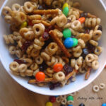 cheerios, chocolate, pretzels in a bowl