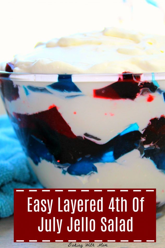 Red and Blue Jello with white whipping cream in a glass bowl