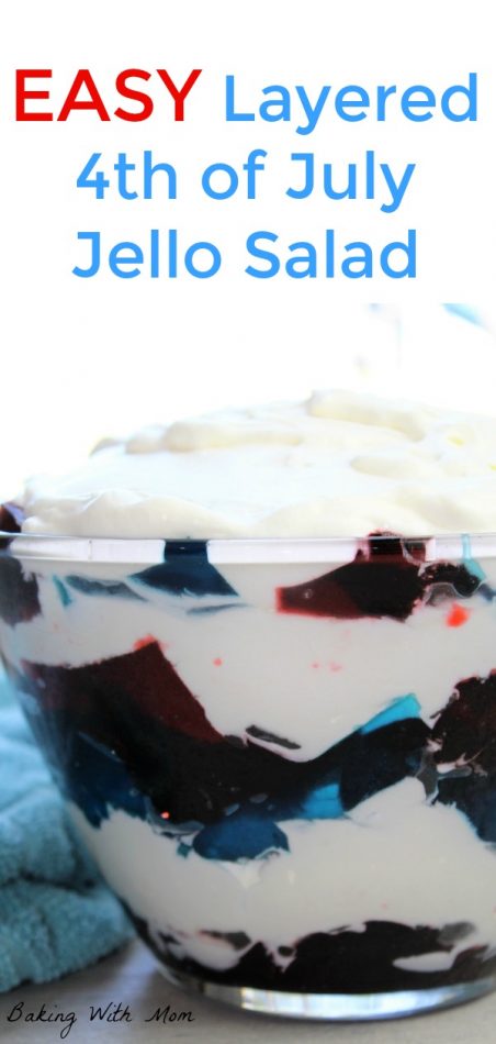 Easy Layered 4th of July Jello Salad in a clear bowl with a blue towel