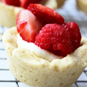 Strawberries and raspberries in a sugar cookie cup with cream cheese