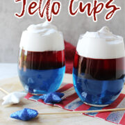 red white and blue jello cups on a wooden board.