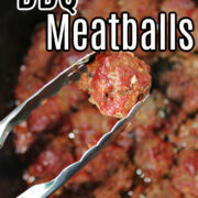 BBQ Meatballs with tongs in a crock pot.
