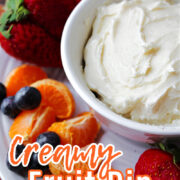 Creamy Fruit Dip on a white tray with strawberries and blueberries.