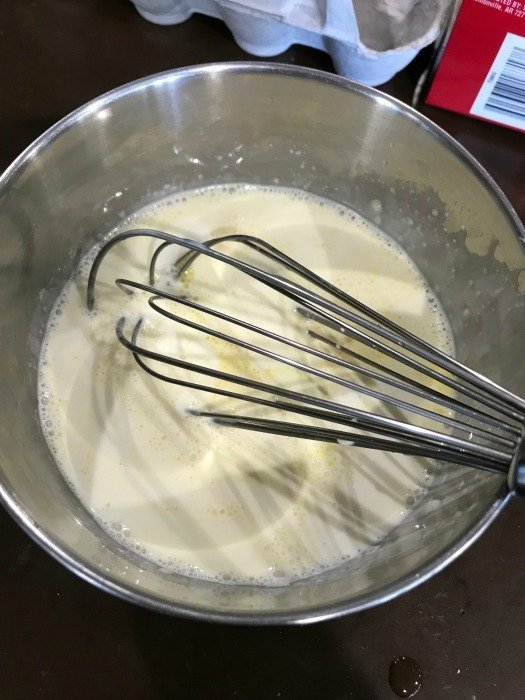 Milk and eggs in a silver bowl