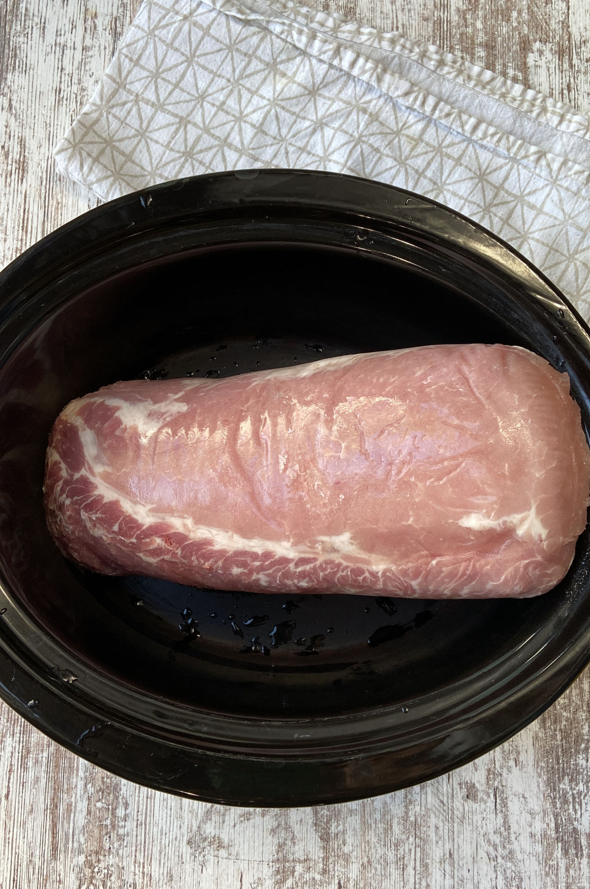 pork loin on bottom of crock pot.