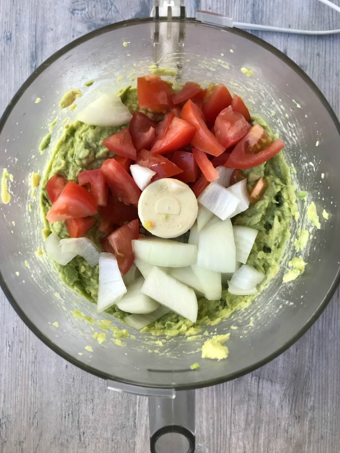 Tomatoes and onions in a food processor 