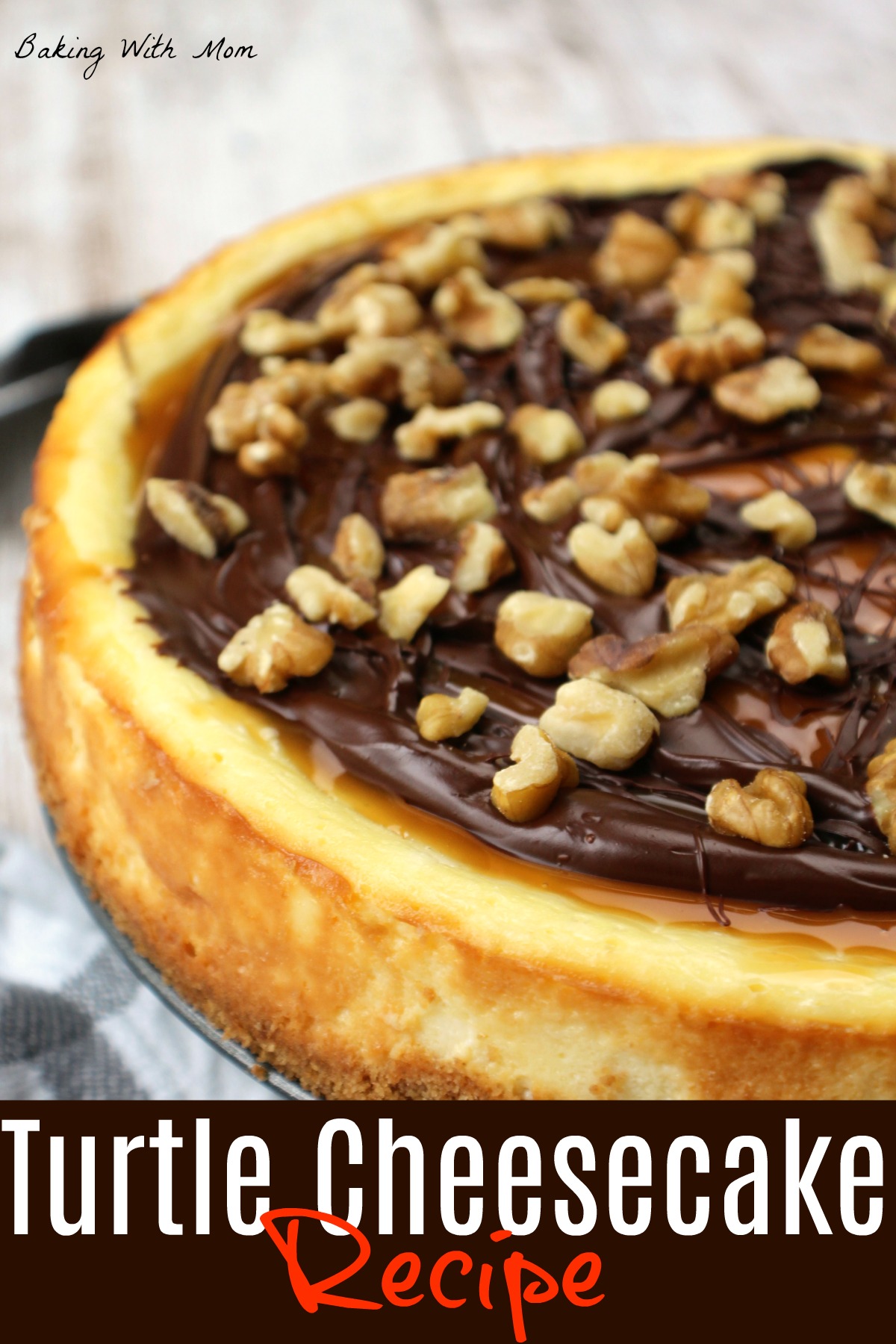 cheesecake on a serving pan with chocolate and caramel drizzle on top