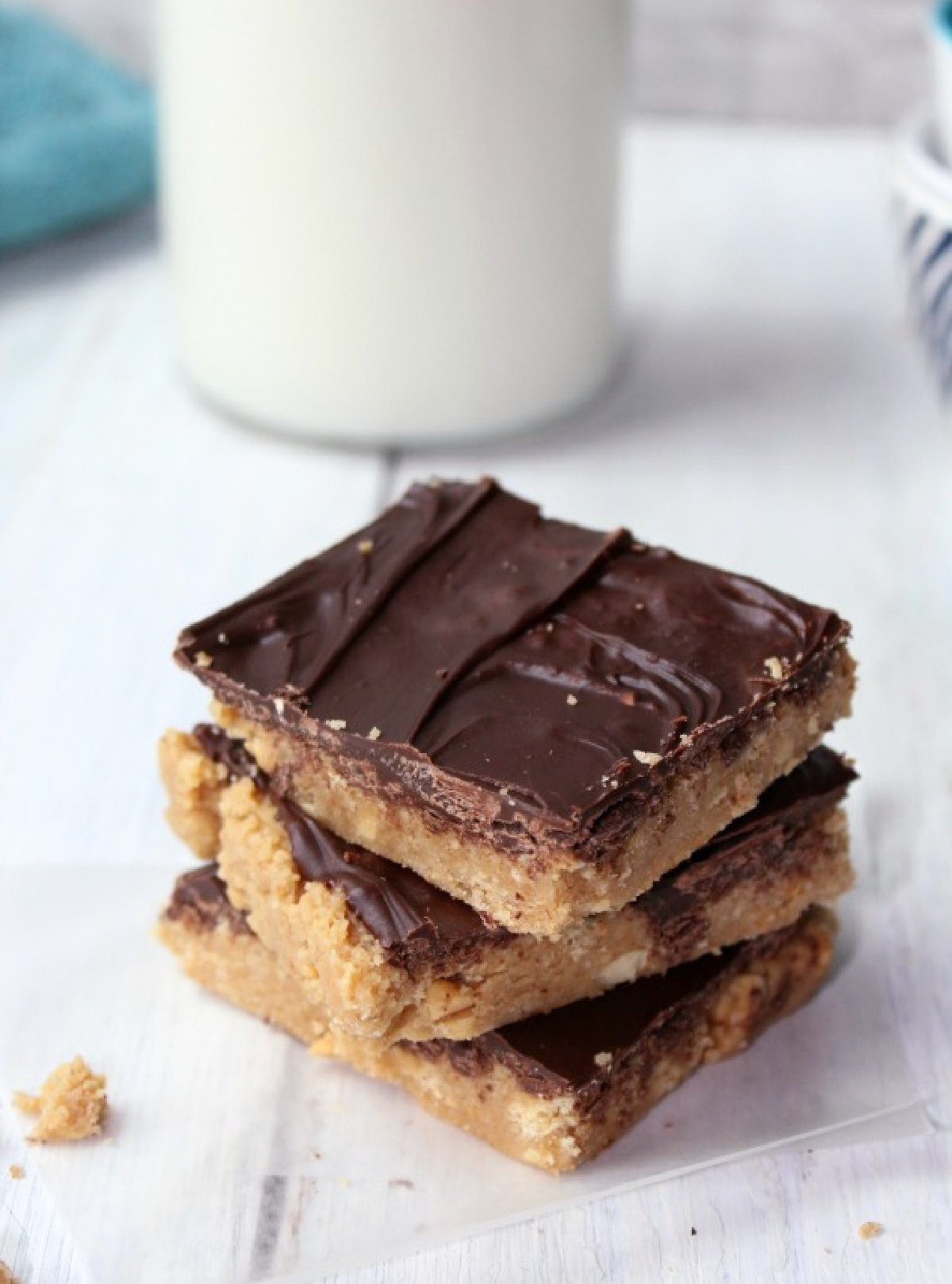 peanut butter bars stacked in three.