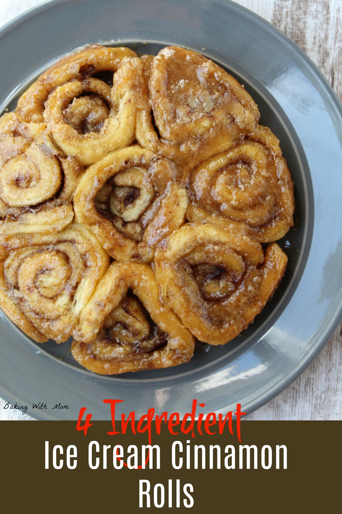 Cinnamon rolls on a gray plate with a brown sugar topping with butter