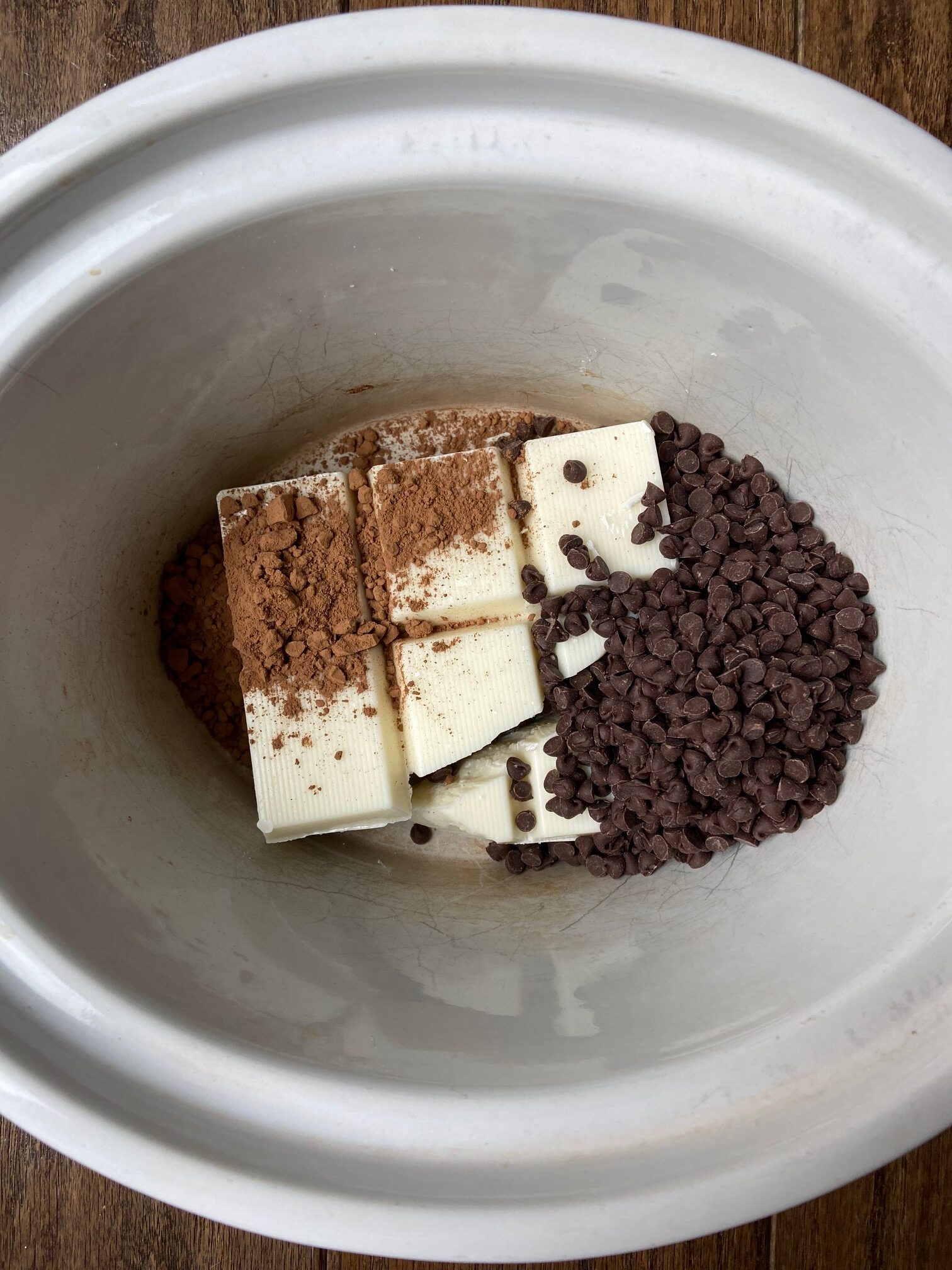 Chocolate layered in a white oval crock pot.