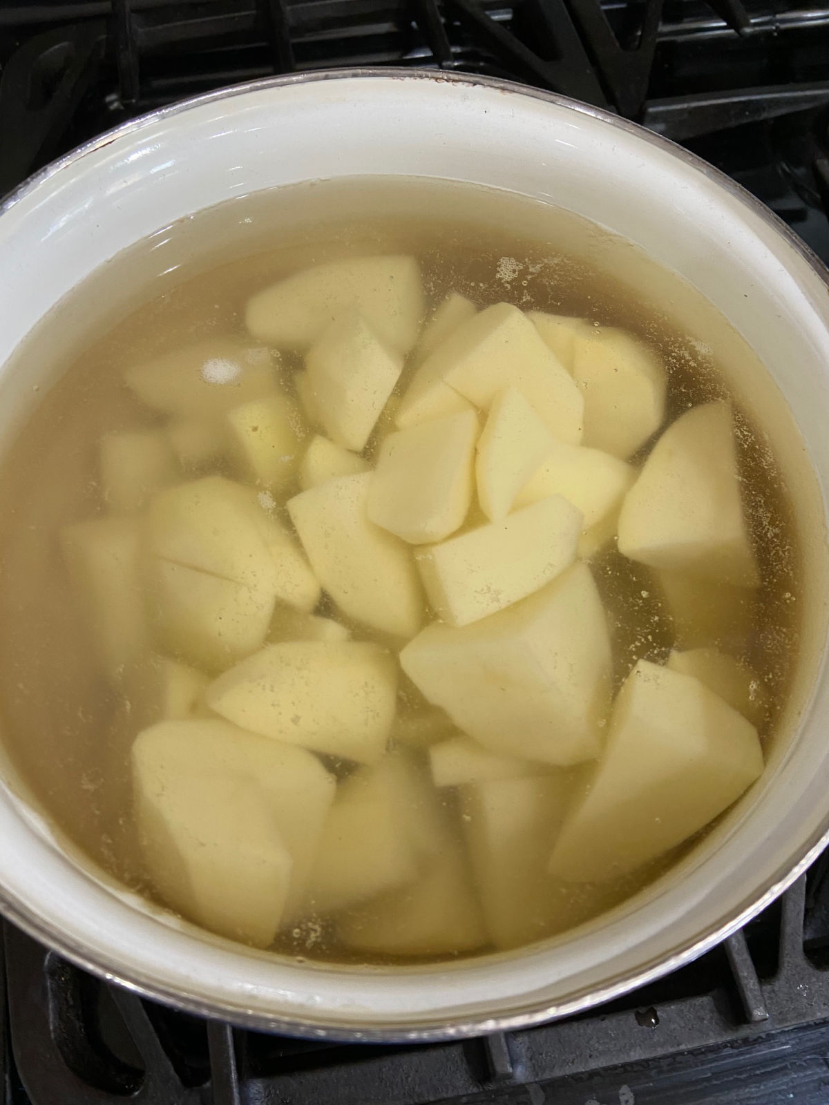 pot of sliced potatoes ready to boil