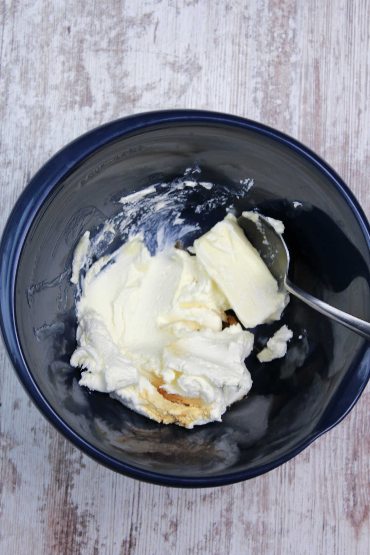 Cream cheese and butter in a mixing bowl