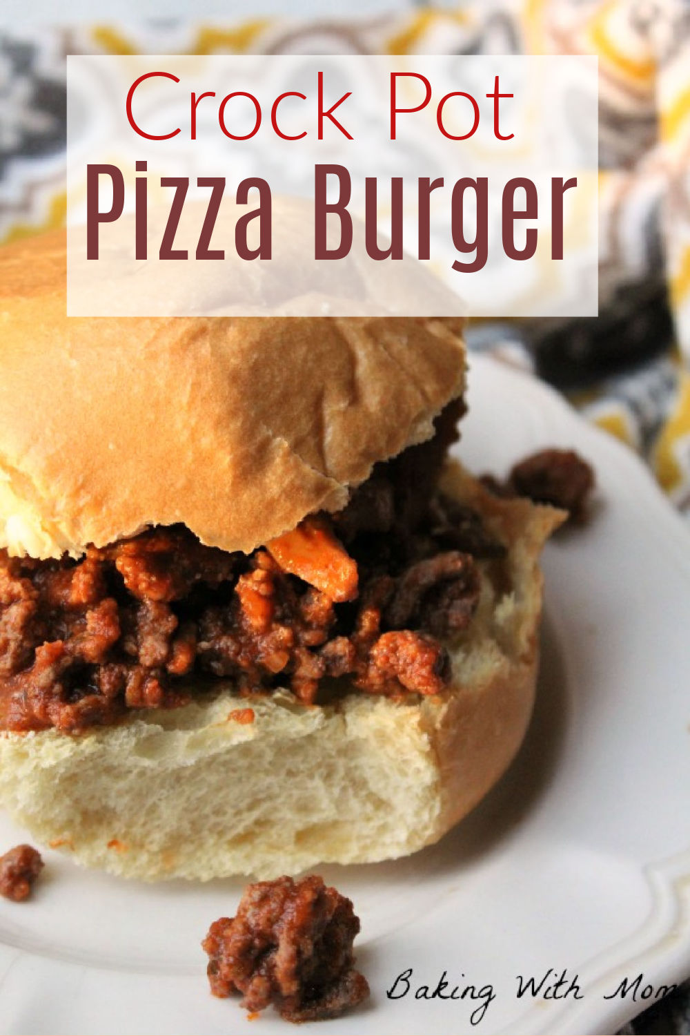 Pizza burger sitting on a hamburger bun on a white plate. 