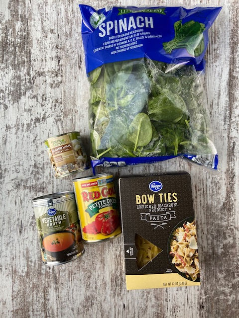 spinach bag, can of tomatoes, bow tie pasta, vegetable broth and mushrooms. 