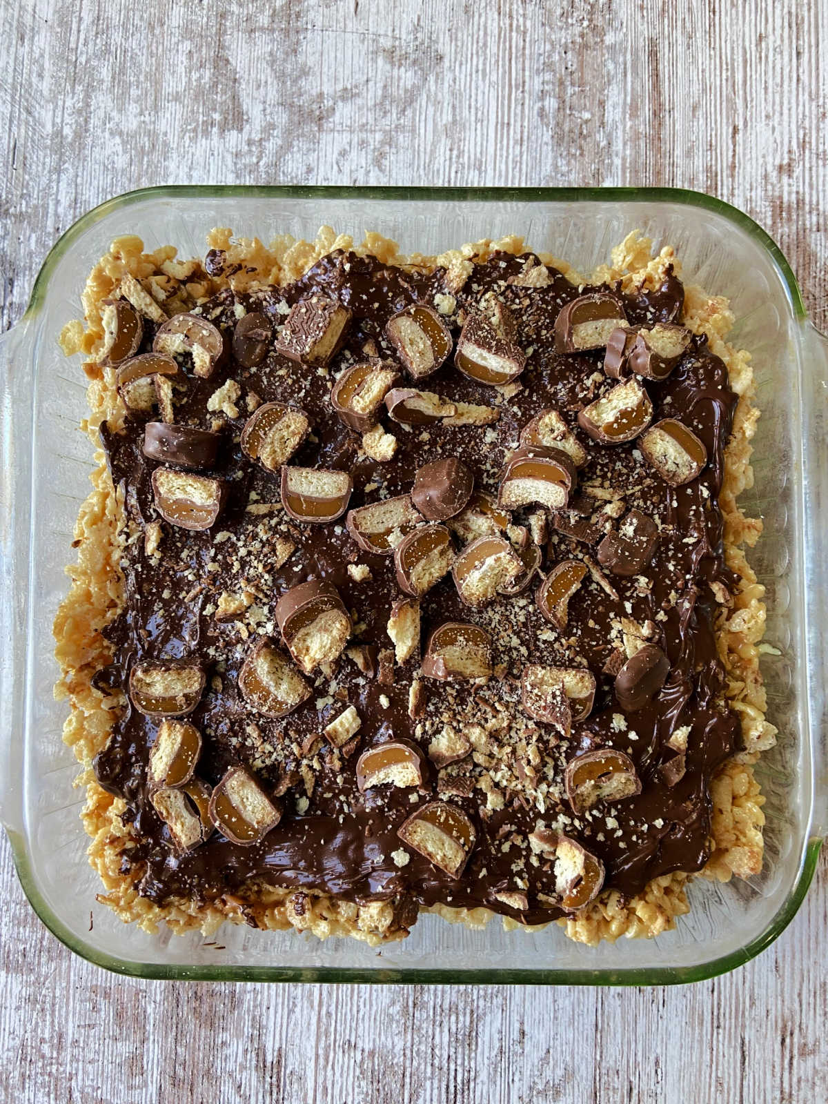 Twix rice krispies in a square baking dish 