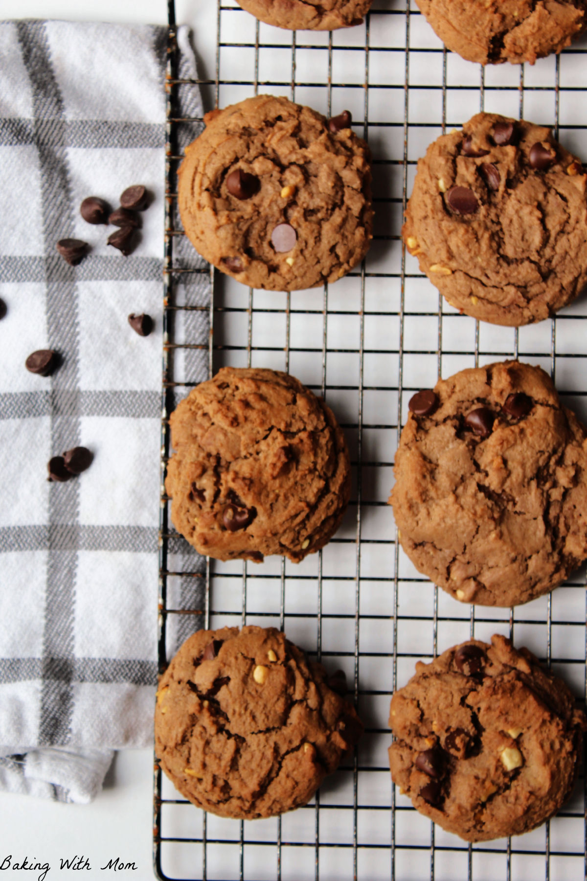 Peanut butter and chocolate cookies on a cooling rack.