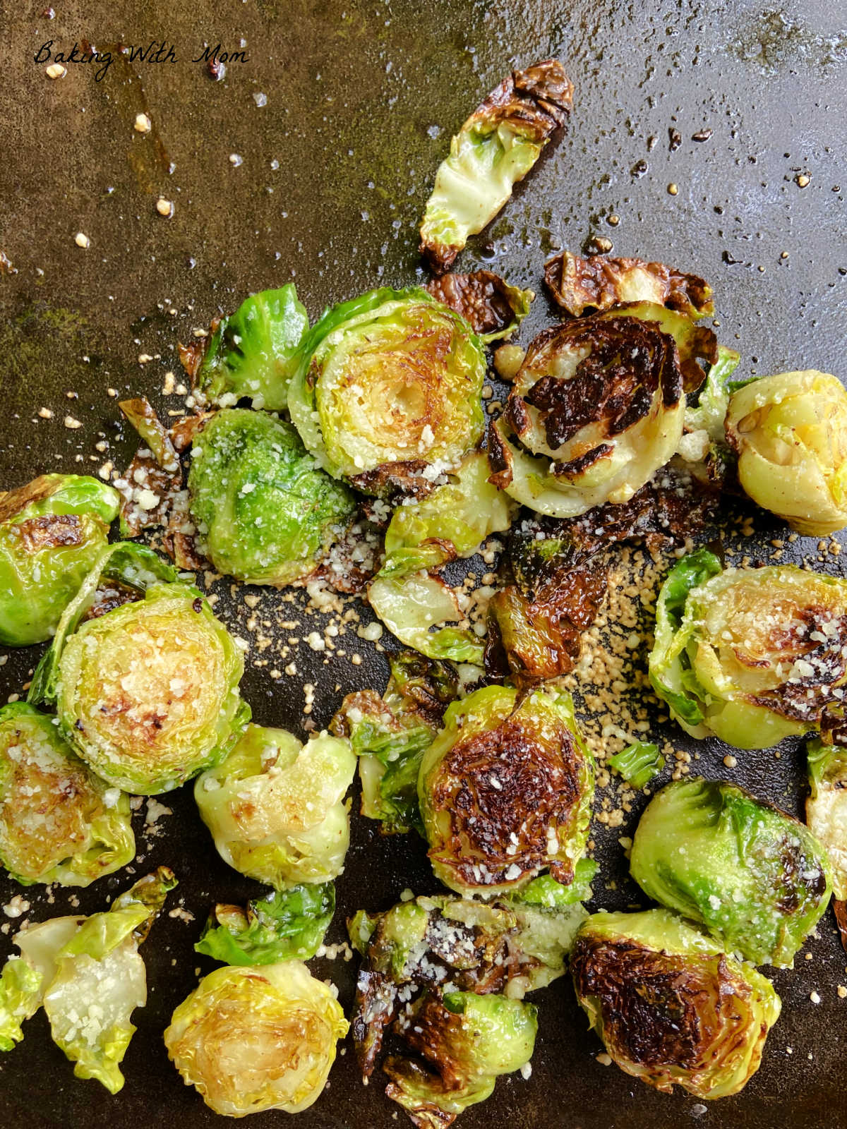 Cooked and flavored sprouts on a flat top grill. 