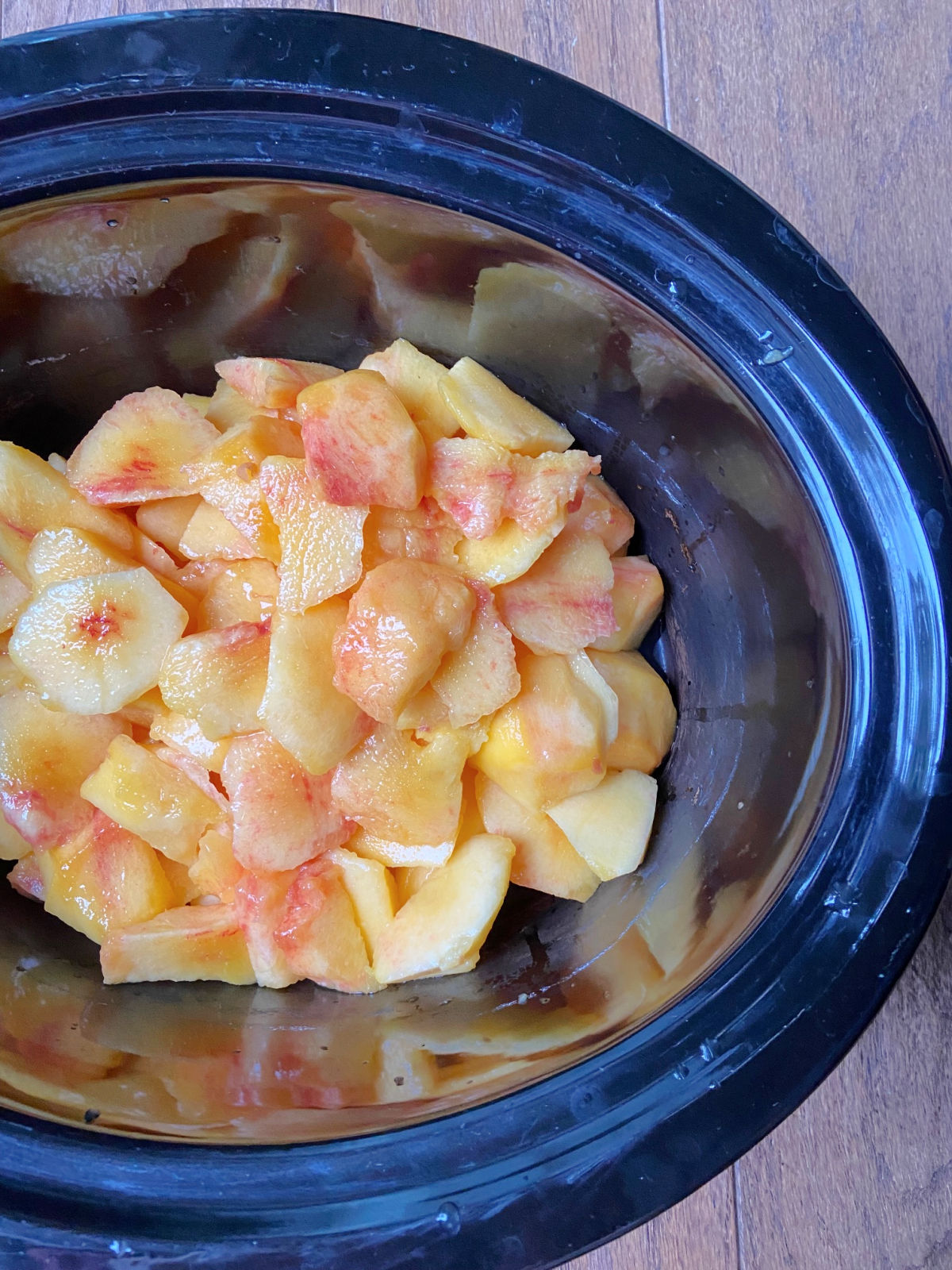 Raw peaches in a crock pot. 