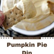 pumpkin pie dip with graham cracker holding dip.