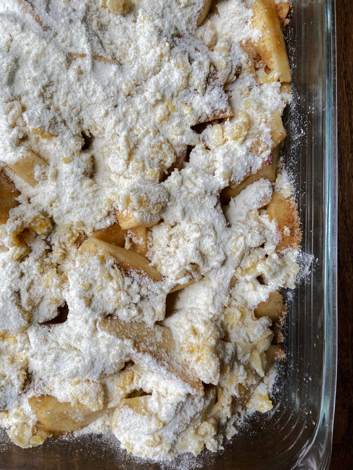 Flour based crumble topping on top of apples. 